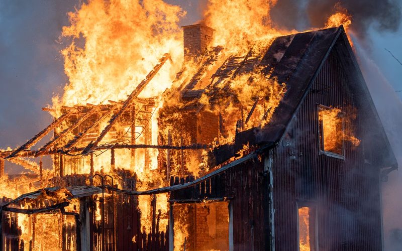 House engulfed in fire and smoke
